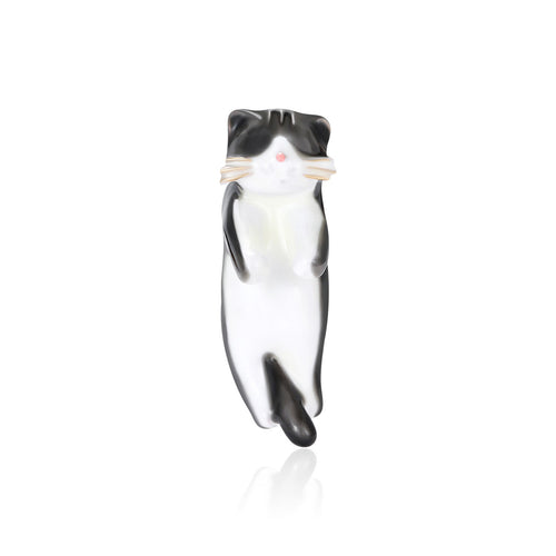Black White Cat brooch styles arranged on a light display