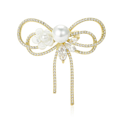 Front view of crystal ribbon bow brooch with pearl and floral detail