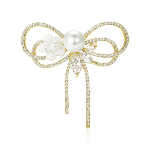 Front view of crystal ribbon bow brooch with pearl and floral detail