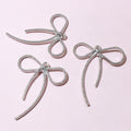 Silver Tone Long-Tail Bow Charm With Textured Outline view 3