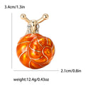 Round Spiral Shell Enamel Snail Brooch in Blue and Orange view 7