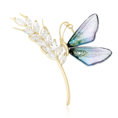 Front view of butterfly and wheat stem brooch with clear crystals