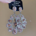 Silver Crystal Teardrop Cluster Stud Earrings with Polished Metal Details view 6