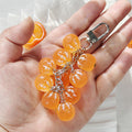 Cluster of Ten Resin Mandarin Oranges Snap-Hook Keychain view 2