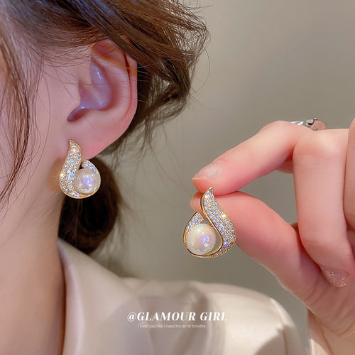Gold Iridescent Pearl Crystal Teardrop Stud shown on a neutral display