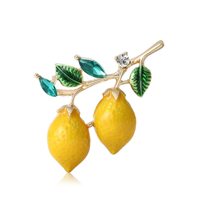 Yellow Double Lemon Branch Brooch With Green Leaves shown from the front on a white background