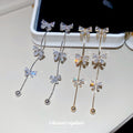 Bow Crystal Chain Drop Stud Earrings in Gold and Silver view 1