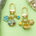 Starfish, Conch and Shell Charm Keychains Featuring Blue Blossom Across 64 Variations view 2