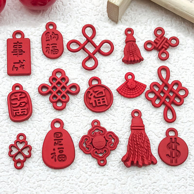 Colorful assorted shape charms arranged on a light background