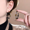 Dark Metal Hoop Earrings with Brown Oval Cabochons view 4