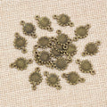 Double Loop Sunflower Connector Charms in Antique Bronze view 3
