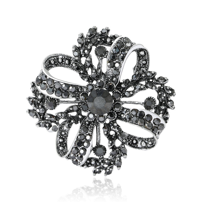 Dark Crystal Openwork Flower Brooch With Looping Petals