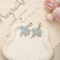 Blue Pink and White Cloud Bear and Butterfly Dangle Earrings view 1