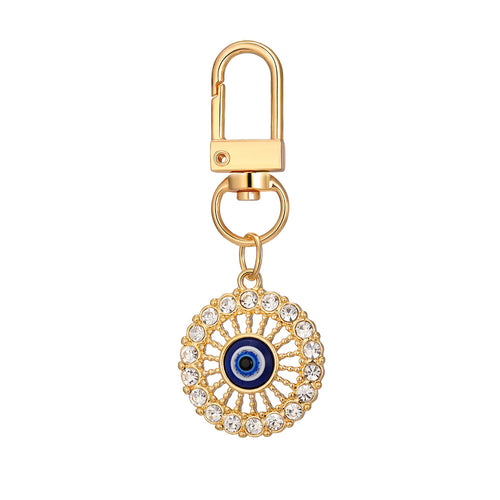 Close-up showing the colors and surface details of twelve Piece Gold Tone Rhinestone Evil Eye Clip Keychain Set