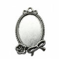 Oval Rose and Bow Cabochon Settings in Two Finishes view 1