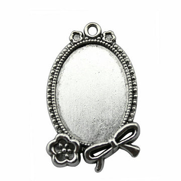 Oval Rose and Bow Cabochon Settings in Two Finishes