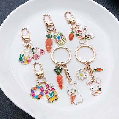 Front product photo of easter bunny egg wreath and carrot keychain showing the pictured design arrangement