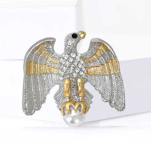 Eagle brooch close-up showing rhinestone chest and gold claws