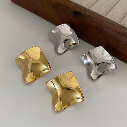 Second listing image of wavy square stud earrings gold silver, showing the visible finish.