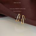 Gold Tone Double Loop Huggie Hoop Earrings With Clear Stones view 4