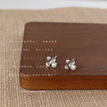 Silver Mini Four Petal Flower Stud Earrings Crystal Centers view 4