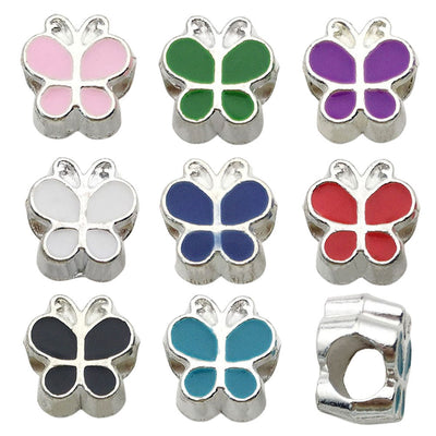 Colorful butterfly and bead beads arranged on a light background