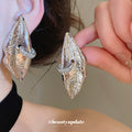 Sculptural Metal Lip Stud Earrings In Gold And Silver view 3