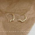 Gold Abstract Face Profile Open Hoop Earrings Minimal Outline Pair view 3