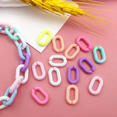 Colorful jewelry chain jewelry findings arranged on a light background