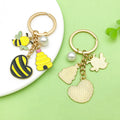 Bee and Honeycomb Charm Keychains Featuring Yellow Heart Across 33 Pictured Variations view 3