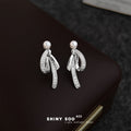 Silver Tone White Pearl And Clear Stone Ribbon Stud Earrings view 3