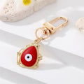 Gold Tone Filigree Oval Teardrop and Star Evil Eye Clip Keychains view 12