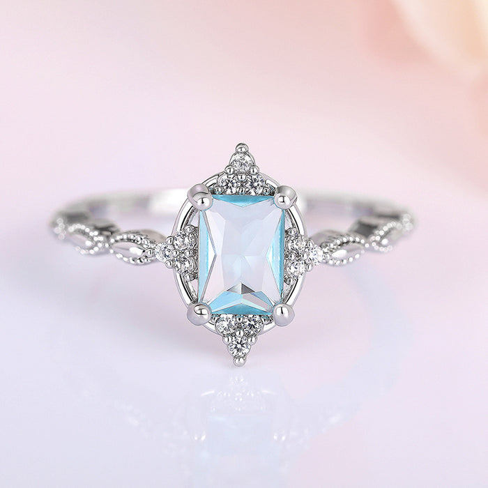 Pale Blue Rectangular Solitaire Floral Slim Ring In Silver Tone