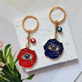 Red and Navy Rose Blue Evil Eye Metal Keychains in Two Styles view 2