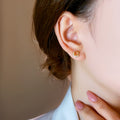 Square Orange Crystal Halo Stud Earrings in Gold Tone view 4