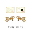 Gold Bow Stud Earrings Clear Pave Stones Star Cutouts view 3