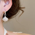 Silver Tone Starfish And Shell Huggie Earrings With Polished Metal Details view 3
