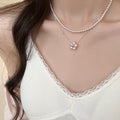 Silver Tone Beaded Necklace with Small Floral Cluster Pendant view 1
