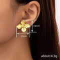 Sculpted Four Petal Flower Stud Earrings in Gold Tone view 4