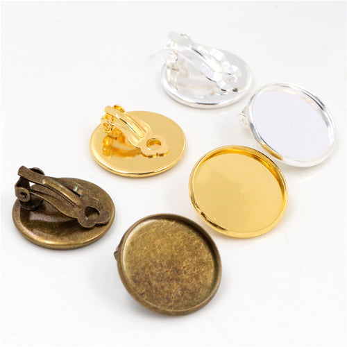Round Cabochon Clip-On Earring Bezel Settings, grouped overview on a plain background