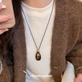 Brown Oval Layered Pendant Necklace On Black Cord Pendant Jewelry view 3