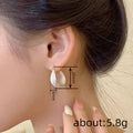 Rounded White Inlay Hoop Earrings in Gold Tone Polished Metal Jewelry view 4