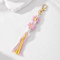 Gold Tone Woven Daisy Tassel Clip Keychains in Two Colorways view 2