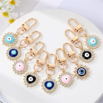 Gold Tone Crystal Heart and Sun Evil Eye Clip Keychains