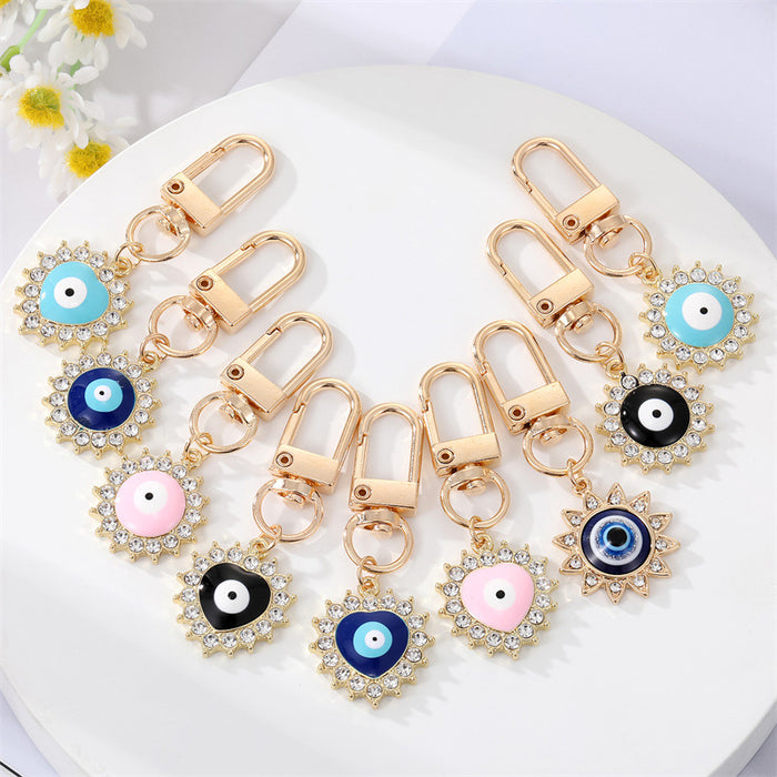 Gold Tone Crystal Heart and Sun Evil Eye Clip Keychains