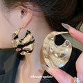 Sculpted Wavy Disc Stud Earrings in Gold and Silver Tone view 4