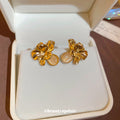 Gold Tone Layered Flower Stud Earrings with Glossy Petals view 4