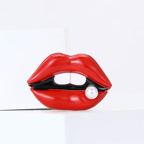 Red lips brooch front view centered on white geometric blocks