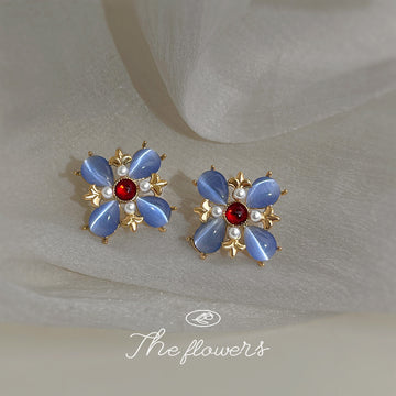 Gold Tone Blue Petal Red Center Flower Earrings In Clip And Stud Styles