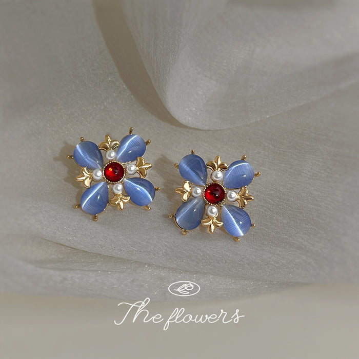 Gold Tone Blue Petal Red Center Flower Earrings In Clip And Stud Styles